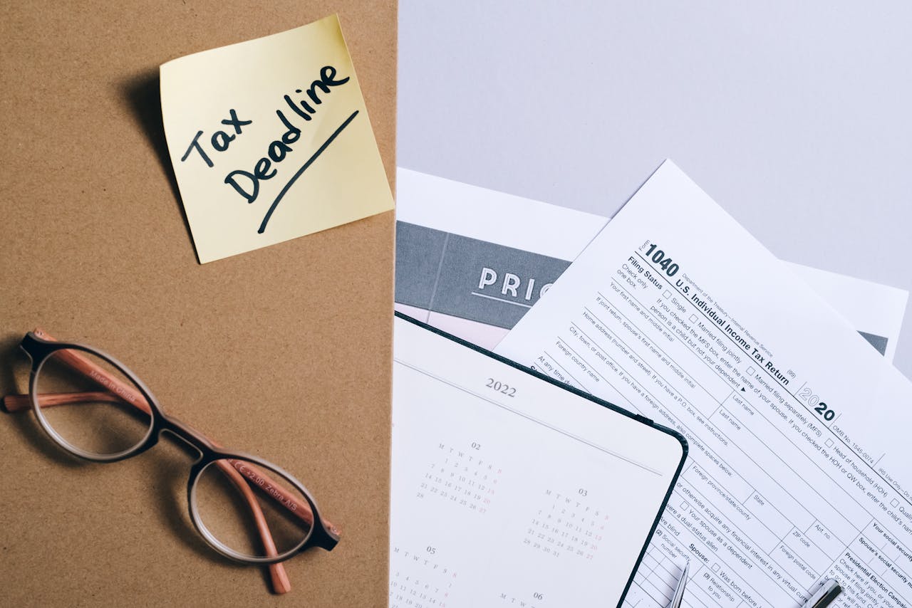 Organized tax preparation essentials with calendar, forms, and deadline reminder.